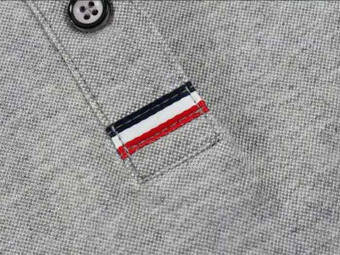 翻領短袖深圳POLO衫定做的門瞳鑲彩帶款式細節展示圖